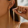 A pair of golden gold-plated jewelry tassels with creative design, elegant, fashionable, simple and versatile earrings, perfect choice for daily gift giving and party wearing for girls and women